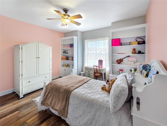 bedroom featuring ceiling fan, wood finished floors, and baseboards