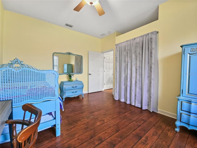 bedroom featuring ceiling fan, hardwood / wood-style flooring, visible vents, and baseboards