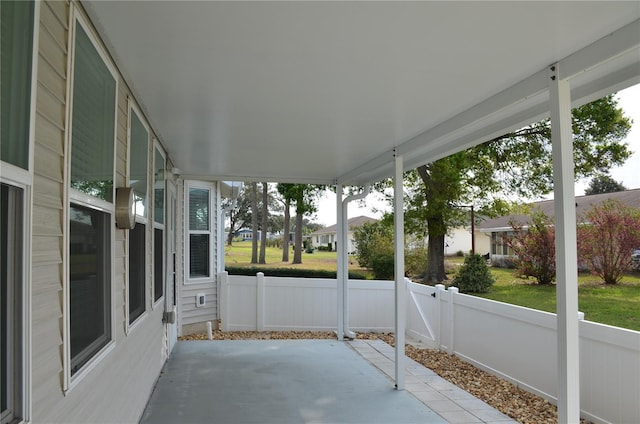 unfurnished sunroom with plenty of natural light