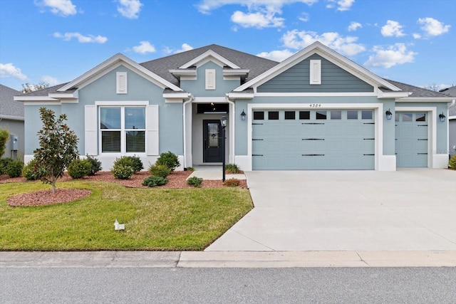 ranch-style home with a garage, a shingled roof, concrete driveway, a front lawn, and stucco siding