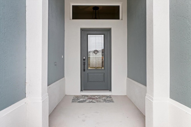 property entrance featuring stucco siding