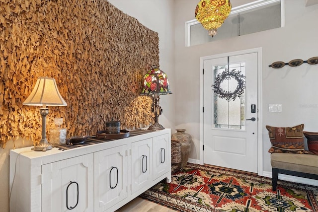 entryway with light wood-style floors and baseboards