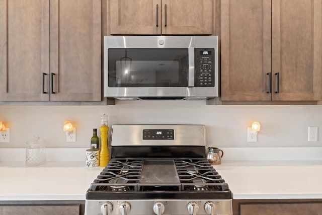 kitchen featuring appliances with stainless steel finishes and light countertops