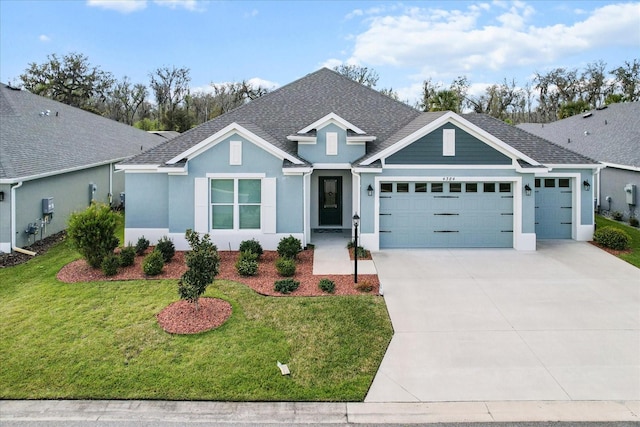 single story home with an attached garage, driveway, roof with shingles, stucco siding, and a front yard