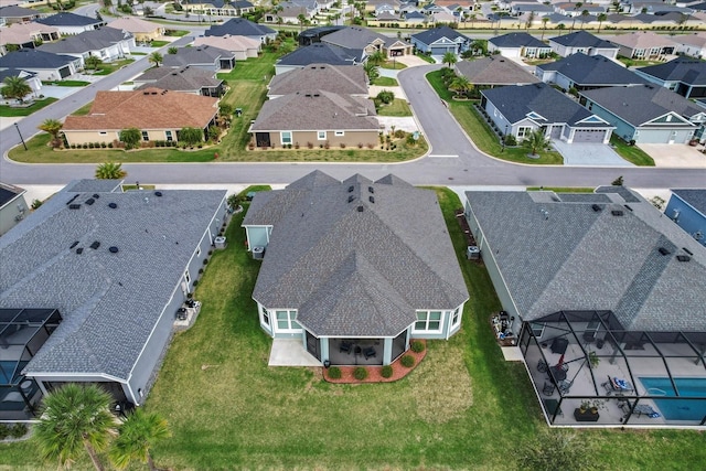 birds eye view of property with a residential view