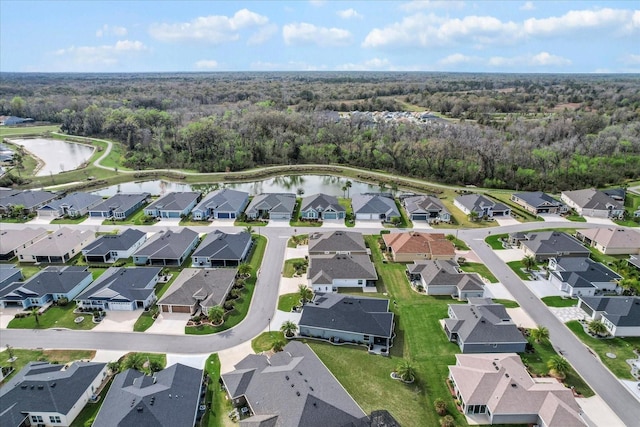 bird's eye view with a water view and a residential view