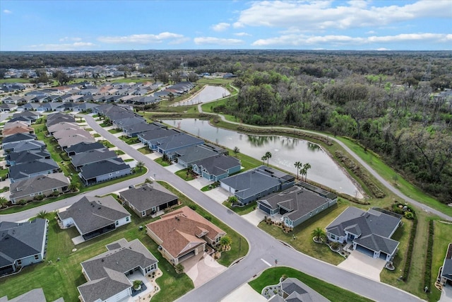 bird's eye view featuring a residential view and a water view