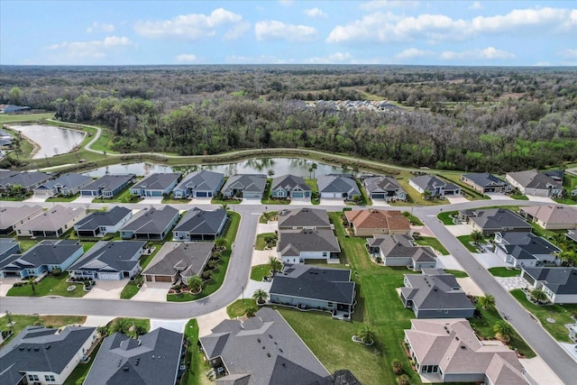 bird's eye view featuring a residential view and a water view