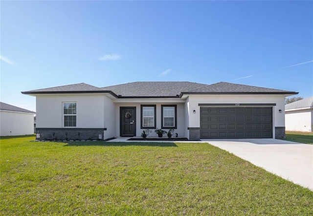 view of front of property with concrete driveway, roof with shingles, an attached garage, a front yard, and stucco siding