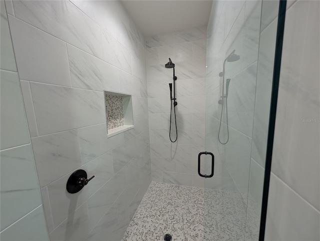 bathroom with a shower stall