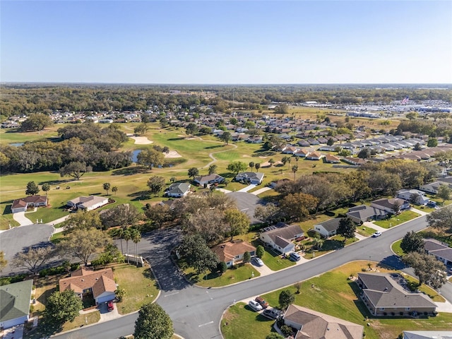 drone / aerial view featuring a residential view and view of golf course