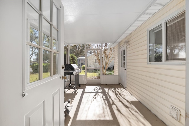 sunroom featuring a healthy amount of sunlight