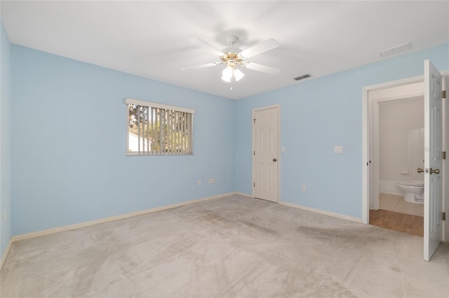 unfurnished bedroom with a ceiling fan, carpet flooring, baseboards, and visible vents