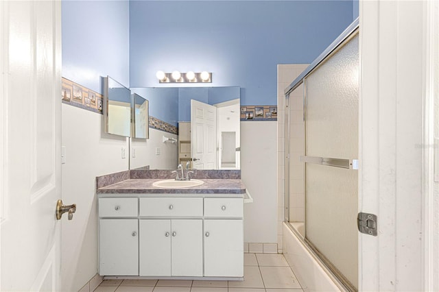 full bath featuring enclosed tub / shower combo, tile patterned flooring, and vanity