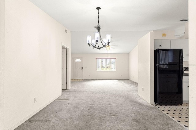 carpeted empty room with a chandelier, visible vents, and baseboards