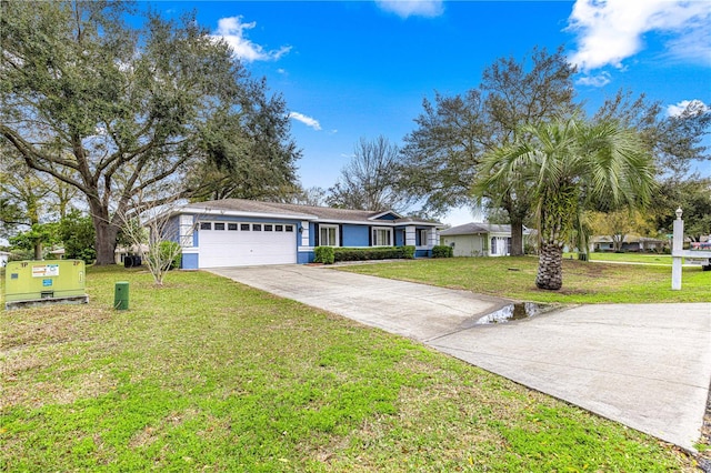 ranch-style house featuring a garage, a front lawn, and concrete driveway