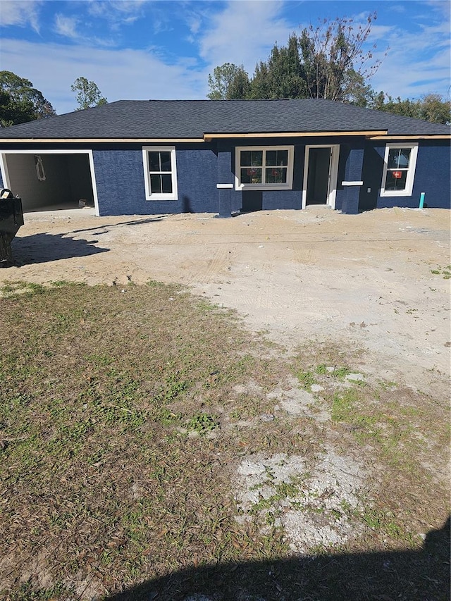 single story home featuring stucco siding