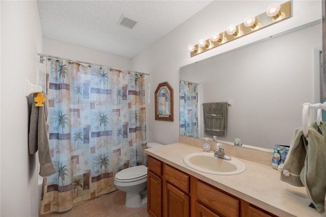 full bathroom featuring curtained shower, visible vents, toilet, a textured ceiling, and vanity