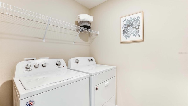 clothes washing area featuring laundry area and washer and dryer