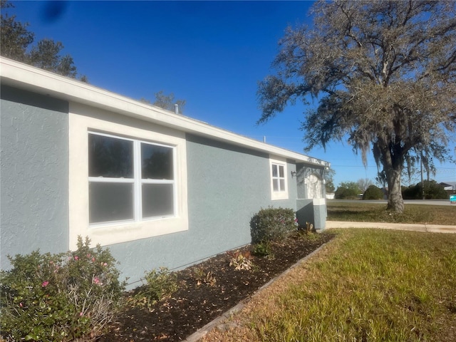 view of property exterior with stucco siding