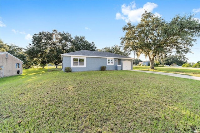 single story home with a front yard, fence, and stucco siding