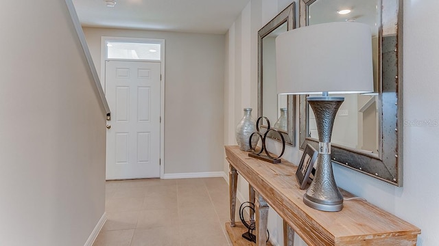 tiled entryway with baseboards