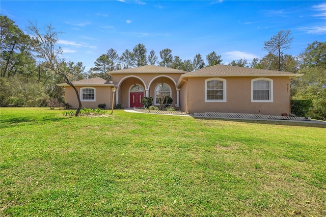 view of front of home featuring a front lawn and stucco siding