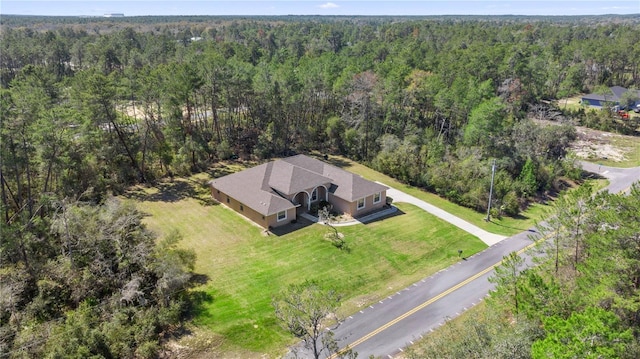 bird's eye view featuring a forest view