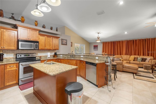 kitchen with tasteful backsplash, visible vents, stainless steel appliances, and a sink