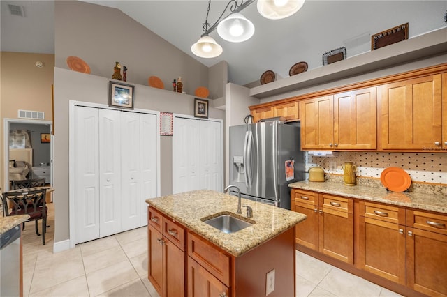 kitchen with light tile patterned floors, appliances with stainless steel finishes, a sink, and visible vents