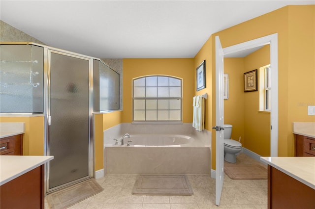 full bath featuring tile patterned flooring, toilet, vanity, a bath, and a stall shower