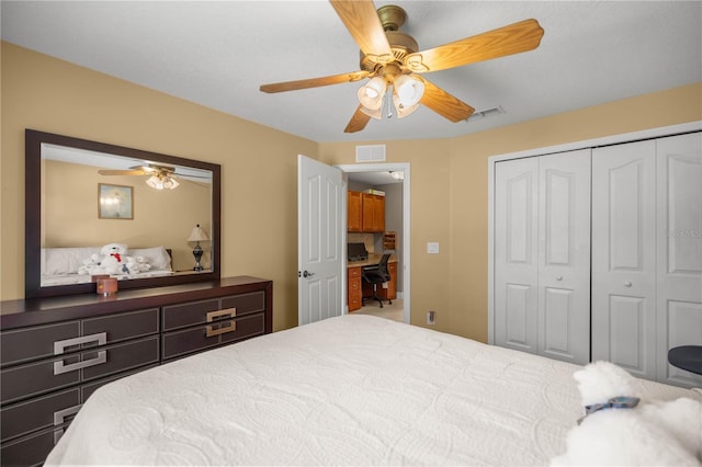 bedroom featuring a ceiling fan, visible vents, and a closet