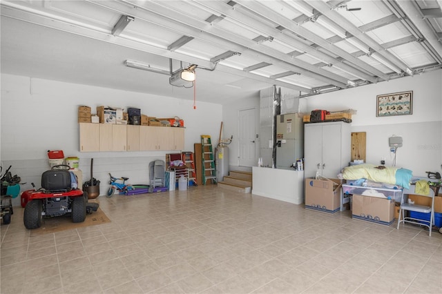 garage featuring a garage door opener, electric water heater, and heating unit