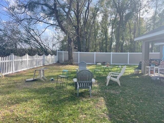 view of yard featuring a fenced backyard