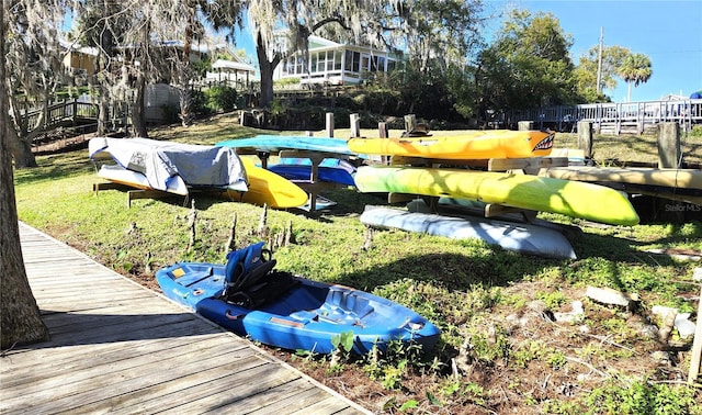 exterior space with a dock and fence