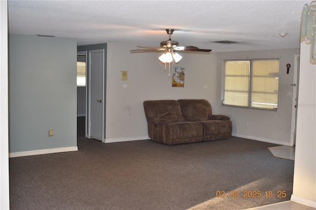 unfurnished living room featuring visible vents, a textured ceiling, a healthy amount of sunlight, and carpet flooring