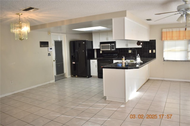 kitchen featuring light tile patterned floors, a peninsula, decorative backsplash, black appliances, and white cabinets