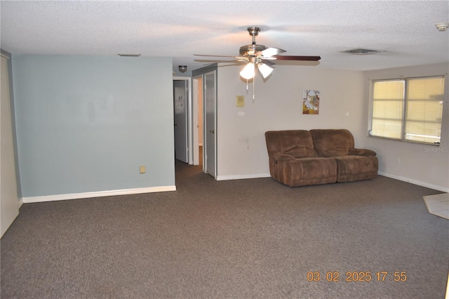 unfurnished living room with visible vents, baseboards, ceiling fan, carpet, and a textured ceiling