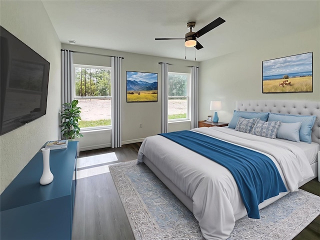 1370 SW Obee Ridge Rd, Dunnellon, FL 34432 - bedroom featuring multiple windows, wood finished floors, and ceiling fan