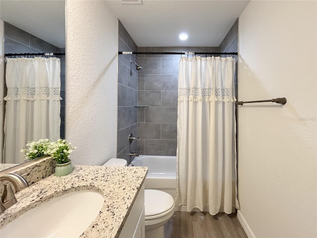 1370 SW Obee Ridge Rd, Dunnellon, FL 34432 - full bath with wood finished floors, vanity, and shower / bathtub combination with curtain