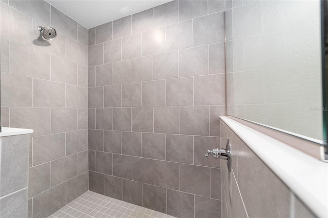 bathroom with a tile shower