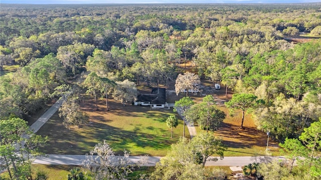 aerial view with a wooded view