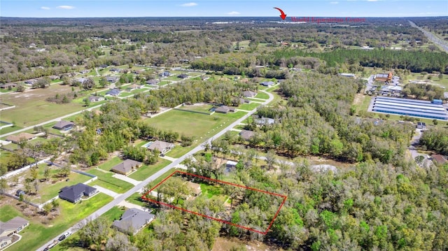 bird's eye view featuring a view of trees