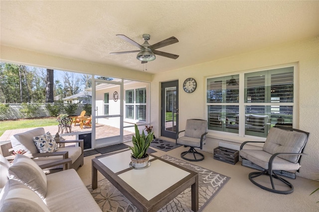 view of patio featuring an outdoor living space, ceiling fan, and fence