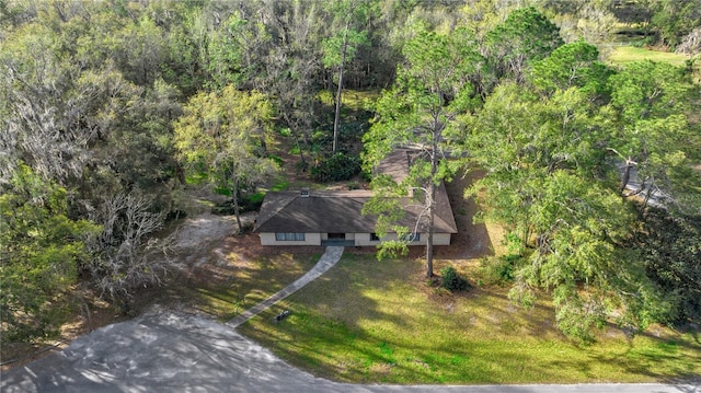 drone / aerial view with a view of trees