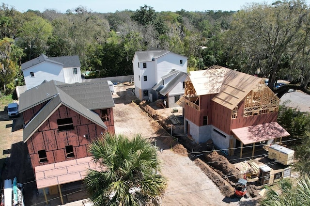 drone / aerial view with a wooded view