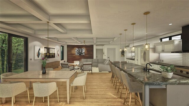 dining area with a chandelier, beam ceiling, coffered ceiling, and light wood-style flooring