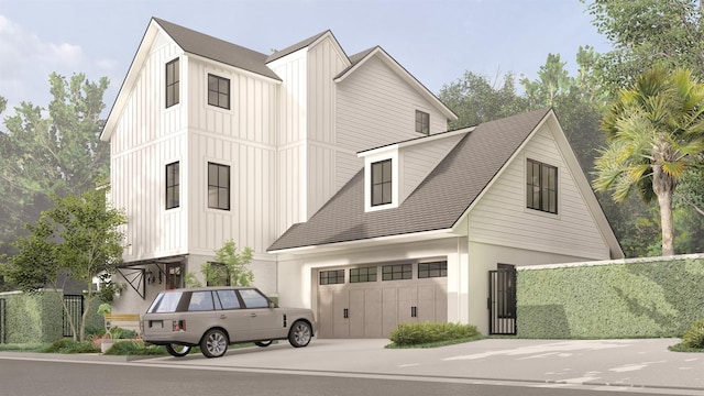 modern inspired farmhouse featuring fence, board and batten siding, and concrete driveway