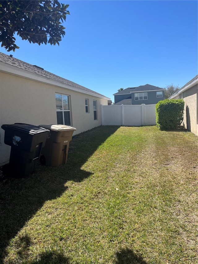 view of yard with fence