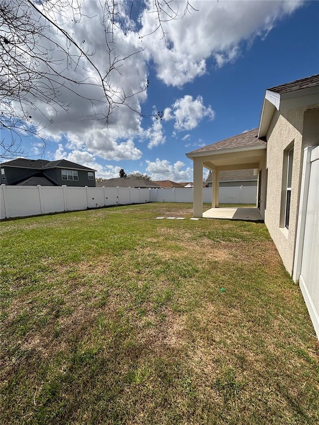 view of yard featuring a fenced backyard and a patio area